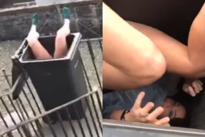 Vrouw zit ondersteboven vast in vuilbak en niemand begrijpt hoe dat kon gebeuren (video)