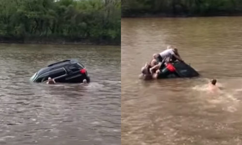 WOW: Heldhaftige omstaanders bevrijden vrouw NET op tijd uit zinkende auto (video)