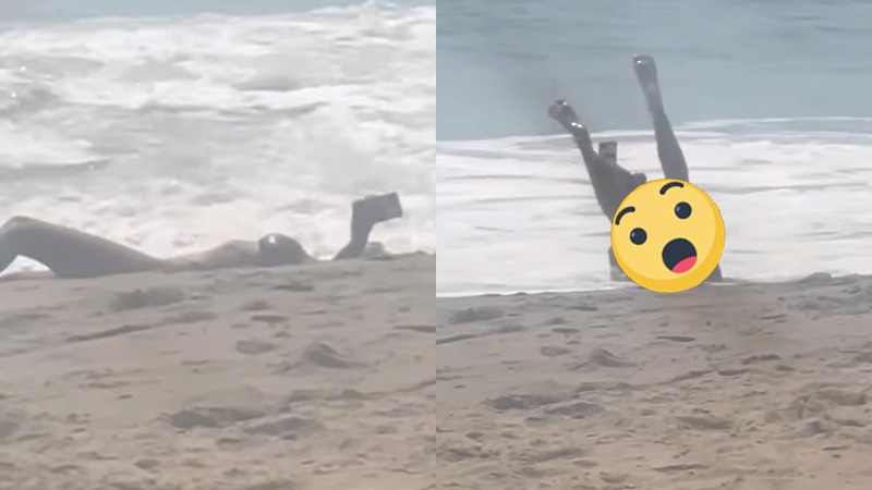 Dame in bikini wil leuke selfie maken op het strand. Maar dan? KLETSNAT! (video)