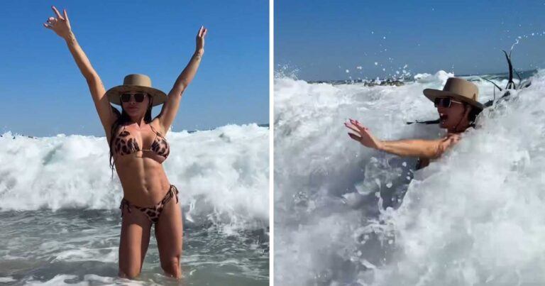Model poseert in zee, maar ZO’N grote golf had ze niet verwacht: “Oh nee!” (video)