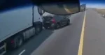 WOW: Automobilist kruipt door het oog van de naald bij botsing tussen twee vrachtwagens (video)